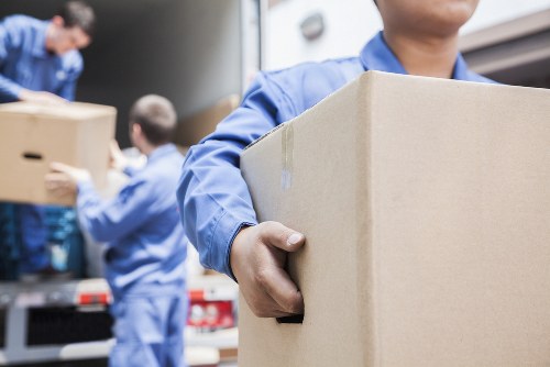 Professional movers handling household items
