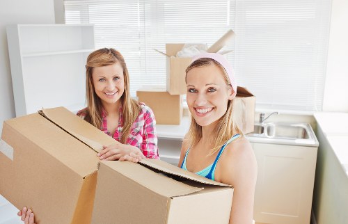 Professional movers loading furniture into a truck