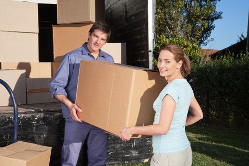 Professional movers handling furniture